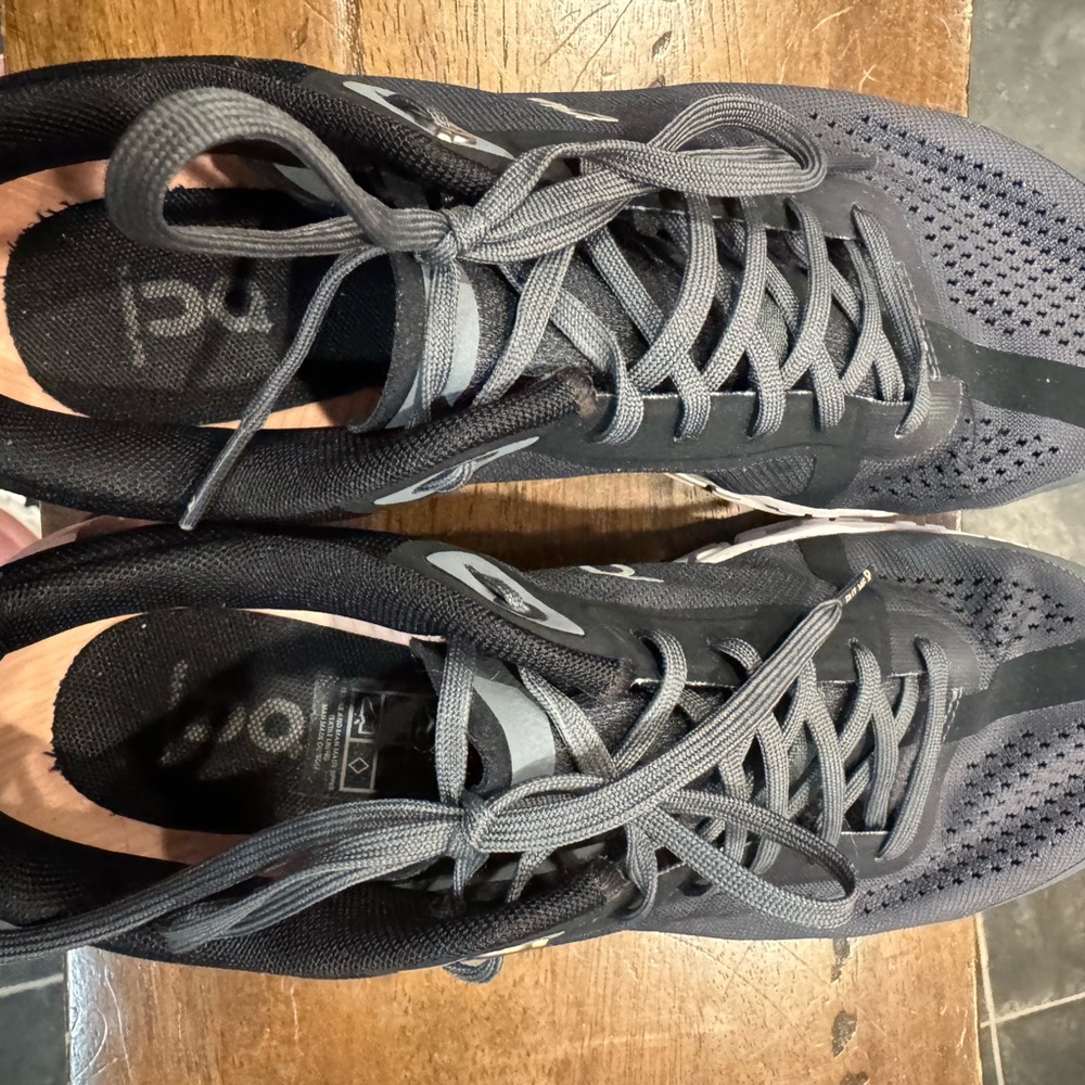 On Running Charcoal and Black Athletic Shoes, in excellent condition.